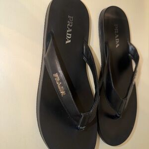 Prada Black Leather Flip Flops with Gold Logo